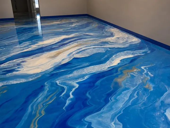 Blue metallic epoxy floor poured across a garage in San Jose, CA