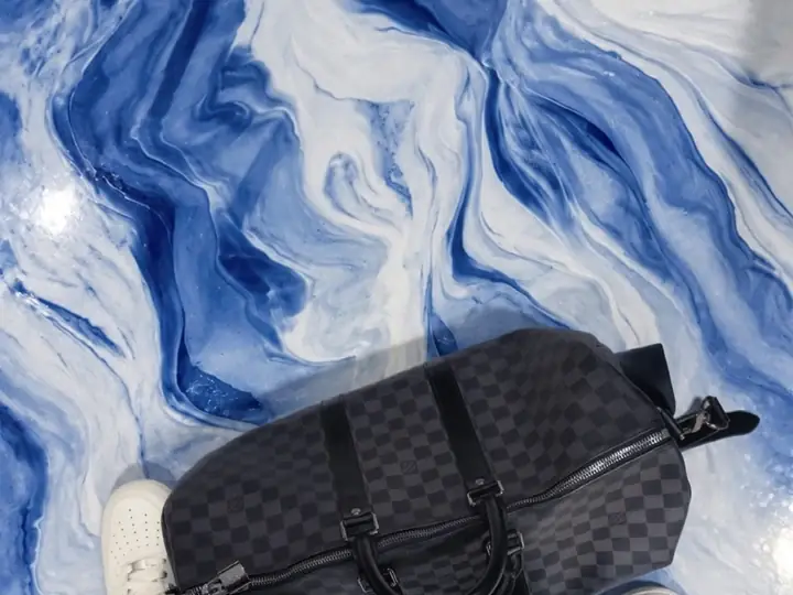 Close up of a blue and white metallic epoxy floor in San Jose, CA